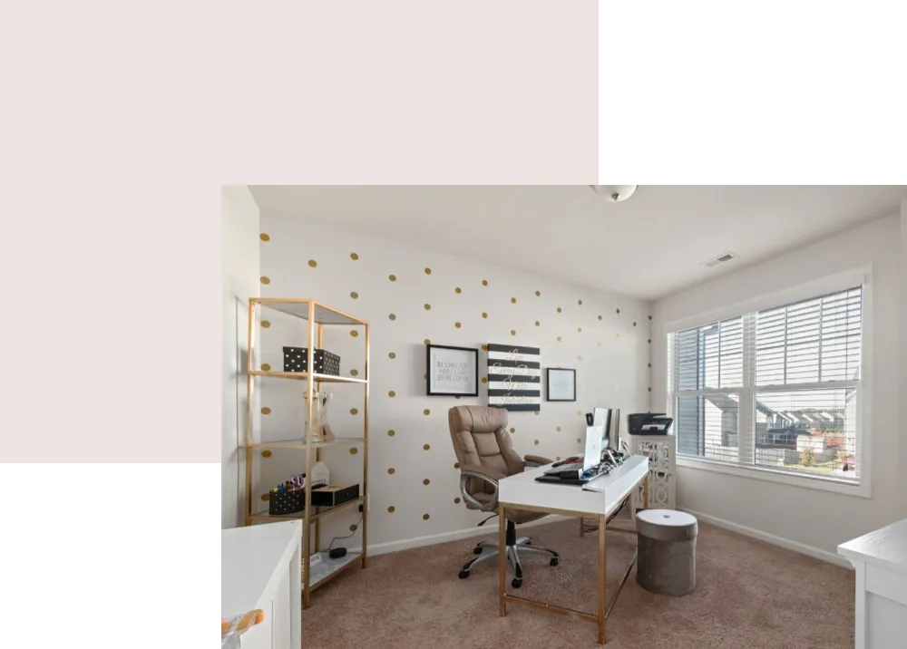 Home office with stylish decor, gold polka dot wall, ergonomic chair, and organized workspace featuring a desk, printer, and storage solutions, emphasizing productivity and aesthetic appeal.