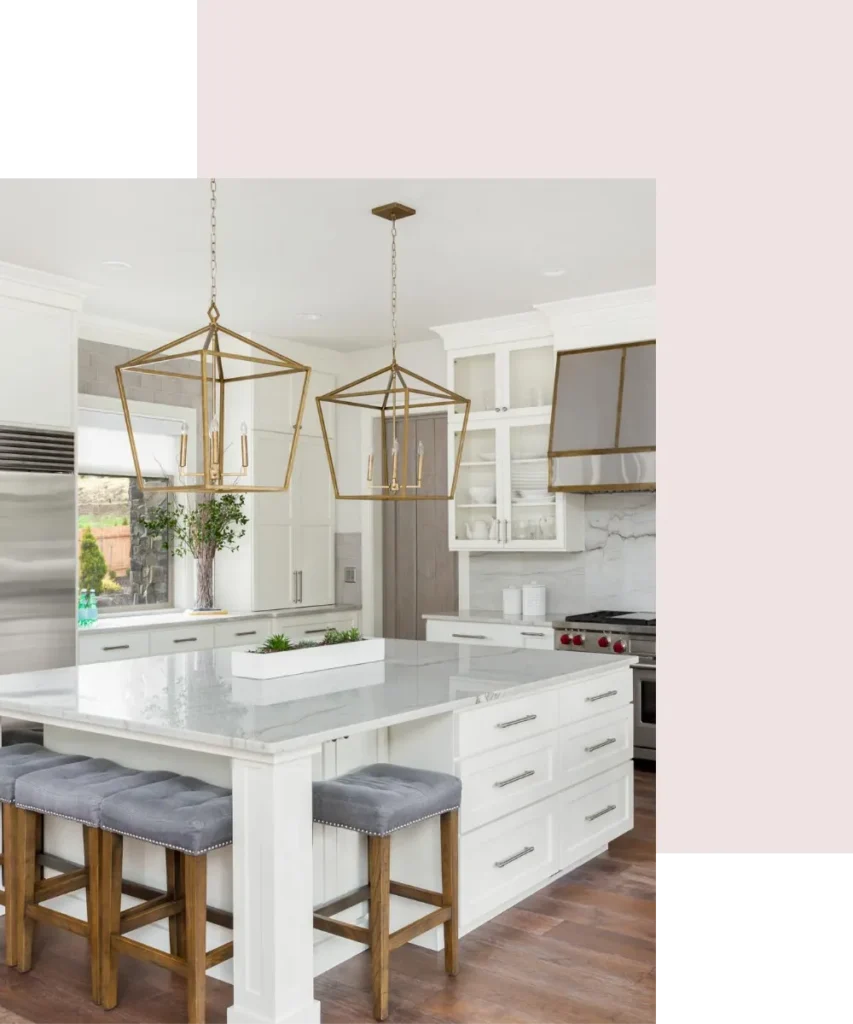 Modern kitchen with white cabinetry, marble countertop, and stylish pendant lights, showcasing a functional and organized space ideal for enhancing home productivity and lifestyle.
