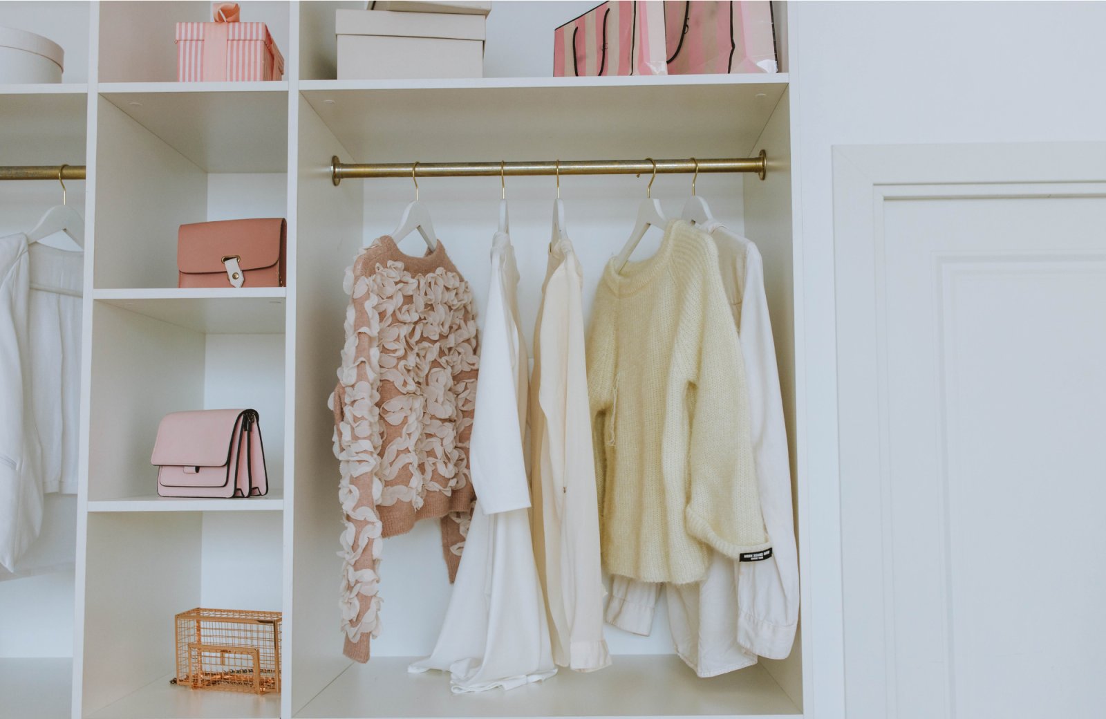 Organized closet showcasing stylish clothing and accessories, emphasizing professional home organization and remodeling benefits.